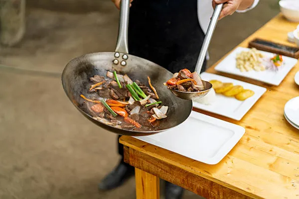 Lomo saltado cooked over high heat in a wok