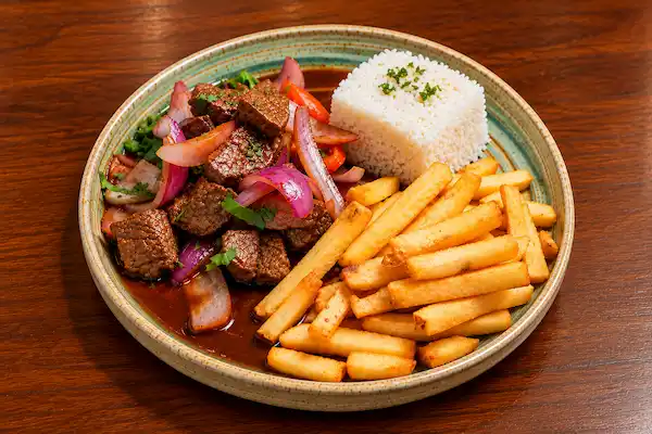 Traditional lomo saltado with beef, rice and French fries