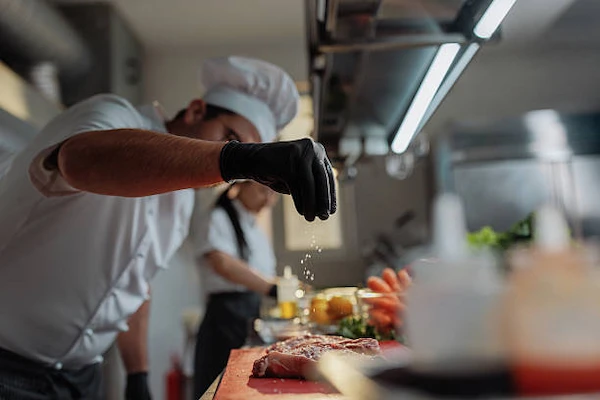 Chef preparing beef for a Peruvian dish